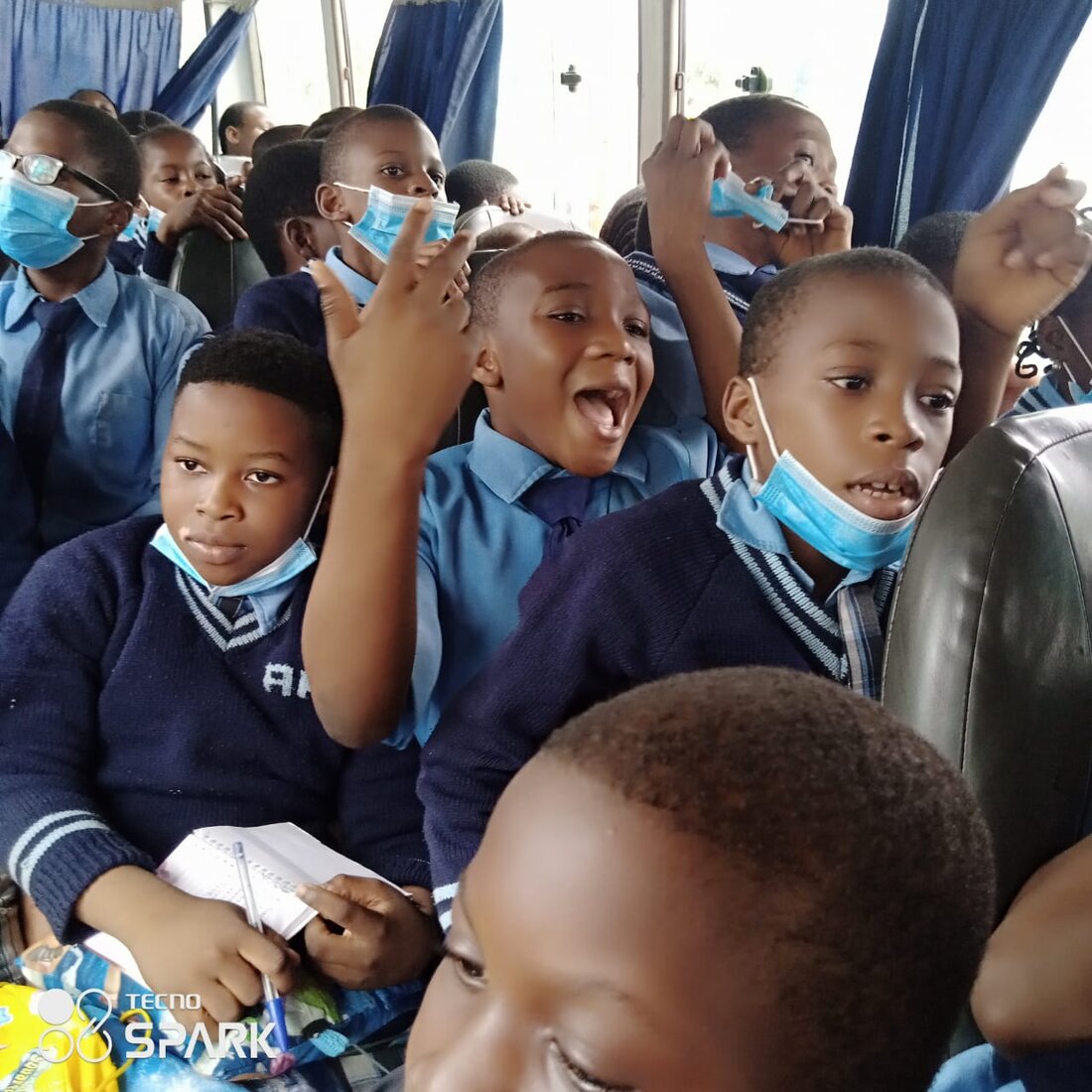 Adetola pupils on a school bus, ready for the day