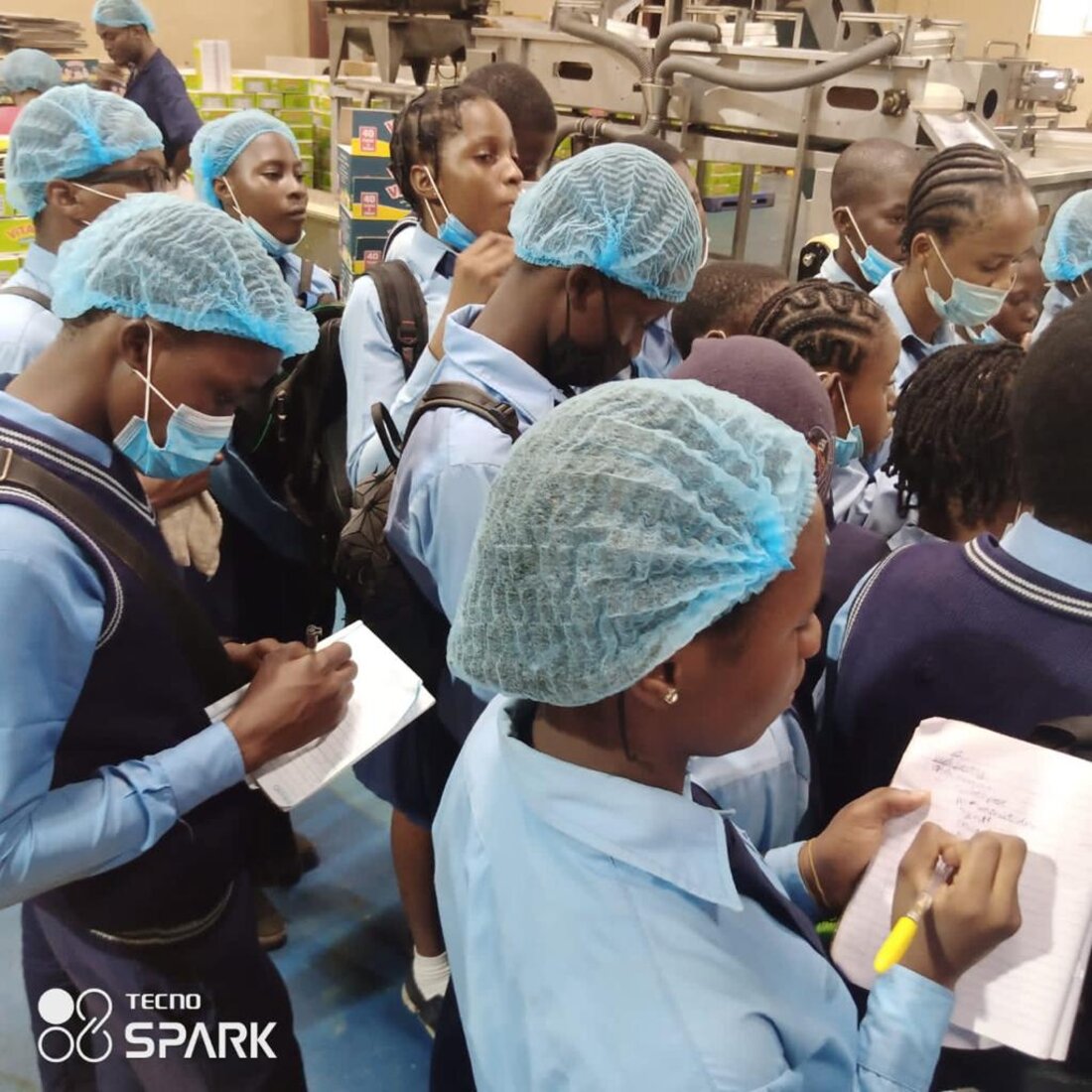 Adetola students on an educational excursion at a production facility