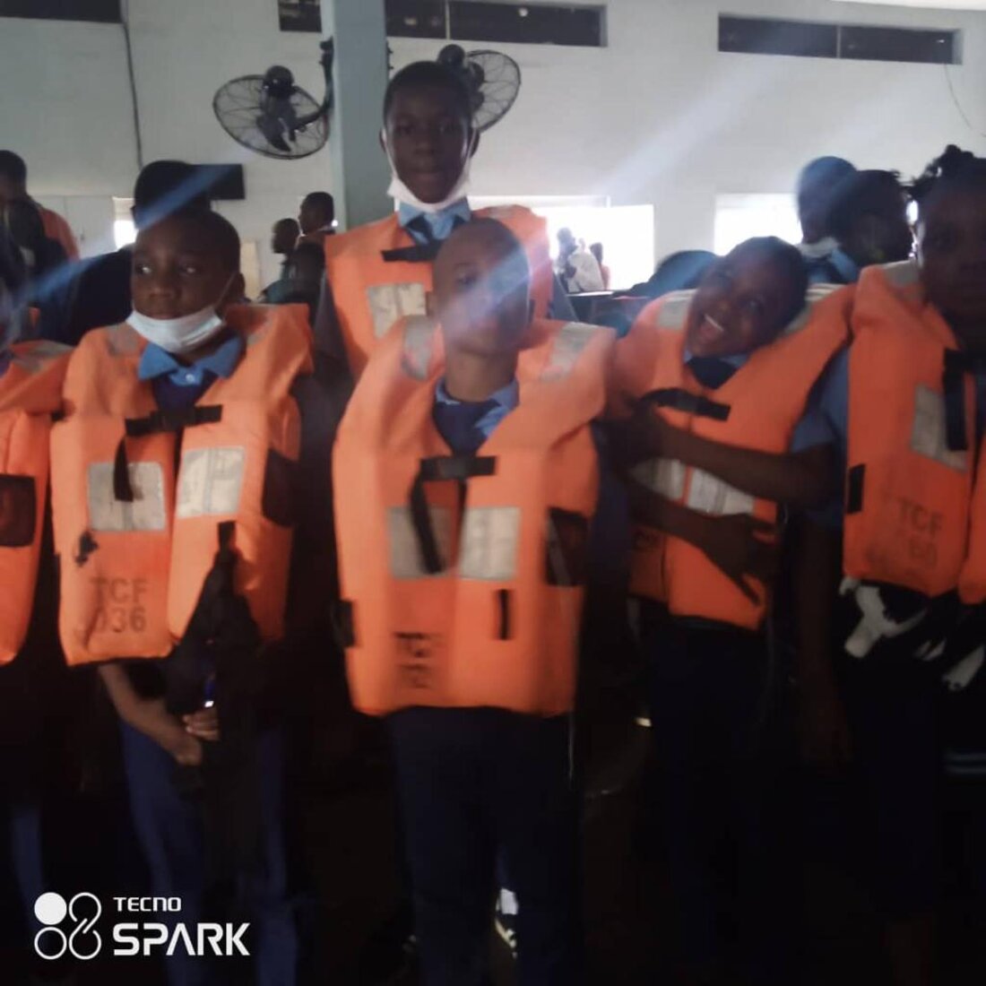 Adetola students wearing life jackets on an educational ferry excursion