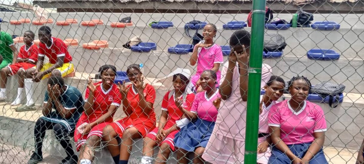 Adetola primary pupils at a sports event in coloured house jerseys